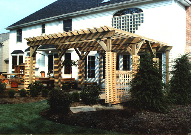 wood pergola with square lattice vine trellis